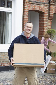 Professional team handling furniture for pick-up in Battersea storage